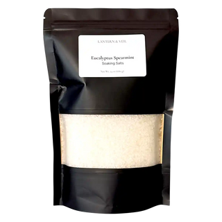 Black packaging of Eucalyptus Spearmint Soaking Salts with a visible label.