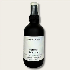 Black spray bottle labeled 'Forever Magical' by Lantern & Veil on a light gray background