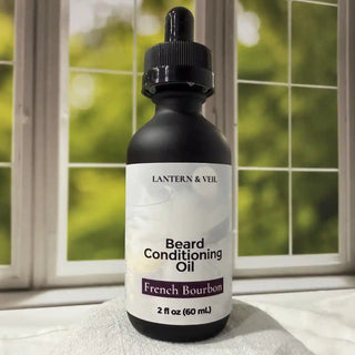 Bottle of Lantern & Veil Beard Conditioning Oil with a dropper on a windowsill.