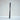 Set of gray fiber diffuser reeds tied with a white string on a light textured surface.