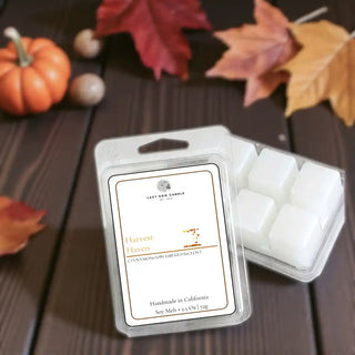 Packaged wax melts with a Harvest Haven label on a wooden surface with an autumn inspired background.