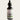 Bottle of Lantern & Veil Beard Conditioning Oil with a dropper on a light gray background