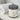 Jar of 'Island Groove' cleansing sugar scrub by Lantern & Veil on a white surface with a towel in the background.