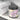 Jar of Mango Dragonfruit cleansing sugar scrub with a black lid on a white surface.