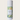 Body powder canister labeled 'Melon Mist' with a green label on a light beige background