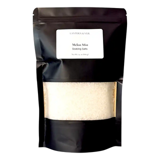 Black packaging of 'Mehn Mist Soaking Salts' with a white label on a white background