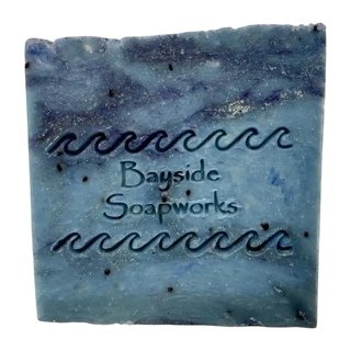 Blue Midnight Cypress soap bar on a white background