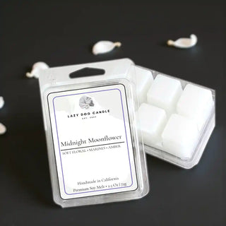 Midnight Moonflower soy wax melt clamshell with white wax cubes on a dark, moody background
