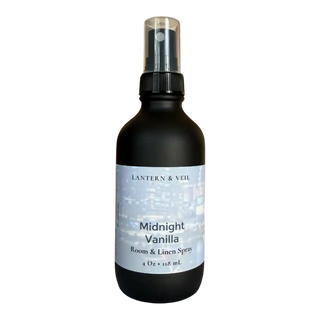 Black bottle of 'Midnight Vanilla' room & linen spray by Lantern & Veil on a white background