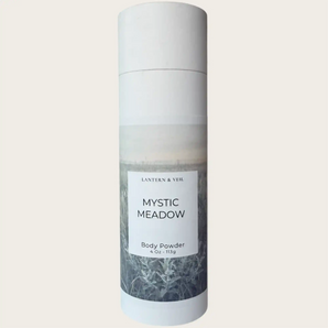Body powder bottle labeled 'Mystic Meadow' on a light gray background
