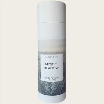 Body powder bottle labeled 'Mystic Meadow' on a light gray background