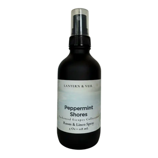 Black spray bottle labeled 'Peppermint Shores' on a white background