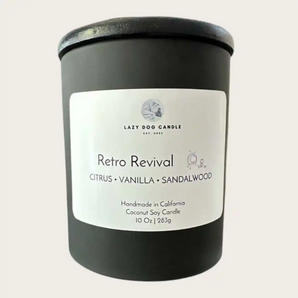 A black glass jar candle with a white label reading 'Retro Revival ' on a light beige background.
