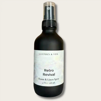 Room and linen spray bottle labeled 'Retro Revival' by Lantern & Veil on a light gray background