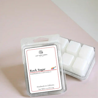 Rock Sugar Soy Melt in clear clamshell packaging on a soft neutral background, handmade soy wax melt with raspberry, sugar, and vanilla fragrance.