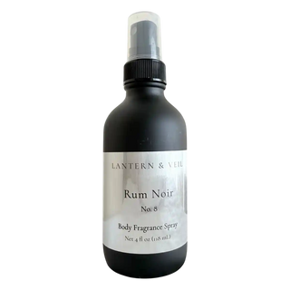 Black body fragrance spray bottle labeled 'Rum Noir' by Lantern & Veil on a white background