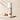 Body powder canister labeled 'Sandalwood Vanilla' with sandalwood and vanilla beans on a beige background