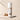 Body powder canister labeled 'Sandalwood Vanilla' with sandalwood and vanilla beans on a beige background