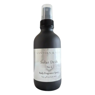 Black body fragrance spray bottle labeled 'Solar Drift No. 6' on a white background
