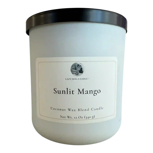 Coconut wax blend candle labeled 'Sunlit Mango' with a black lid on a white background