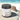 Jar of 'Teakwood Island' cleansing sugar scrub by Lantern & Veil on a beach setting.