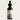 Bottle of Lantern & Veil Beard Conditioning Oil with a dropper on a light gray background