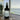 Bottle of Tidewater Spa room and linen spray on a table with a scenic spa like background