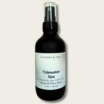 Black spray bottle labeled 'Tidewater Spa' by Lantern & Veil on a light gray background