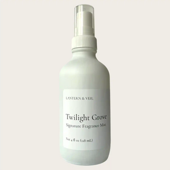 Fragrance mist bottle labeled 'Twilight Grove' by Lantern & Veil on a light gray background
