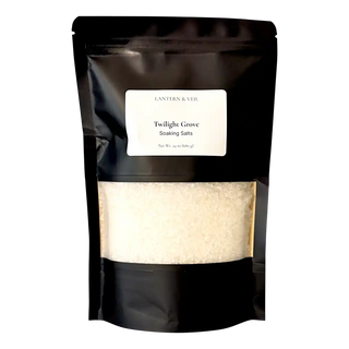 Black pouch with 'Twilight Grove' label containing white powder on a white background