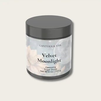 Jar of Velvet Moonlight handmade body scrub with a gray lid on a light gray background