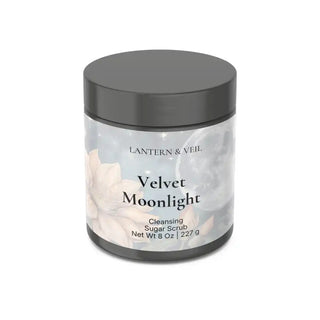 Jar of 'Velvet Moonlight' cleansing sugar scrub with a gray lid on a white background